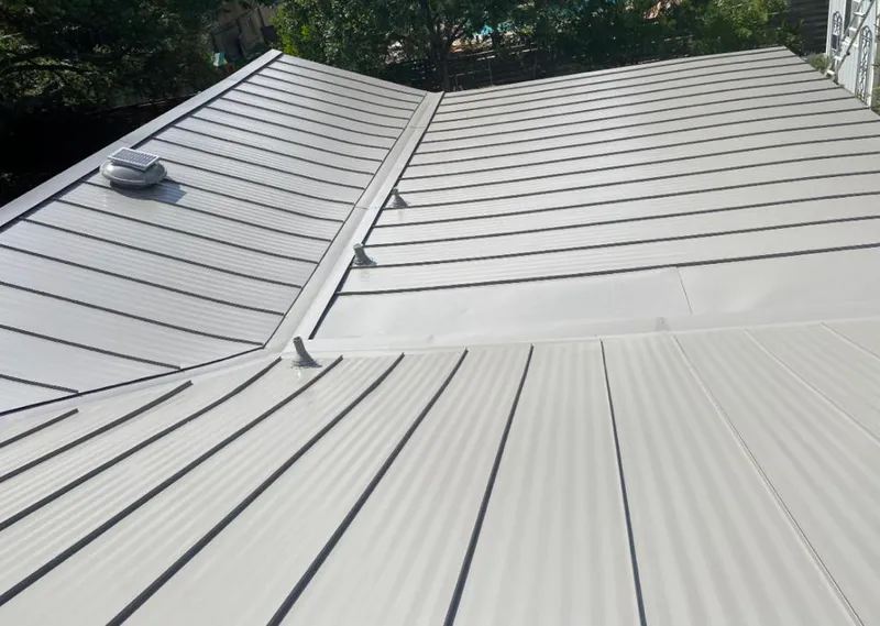 Solar attic fan installed on a metal roof for Roof Ventilation in Leesylvania